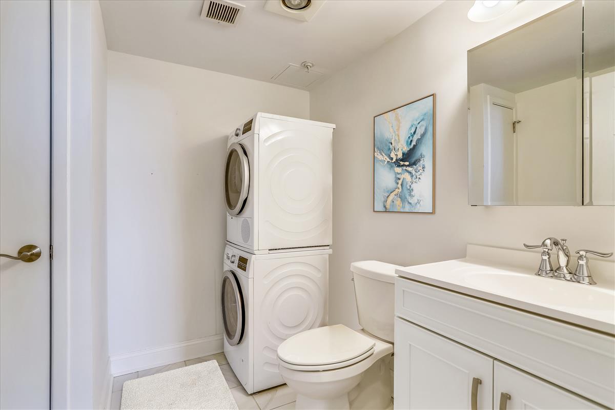 The York bathroom with stacking washer and dryer.